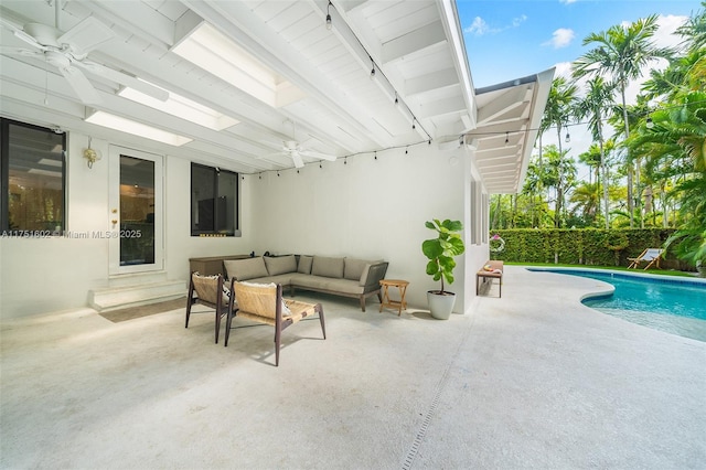 view of patio featuring an outdoor living space, a fenced in pool, and fence