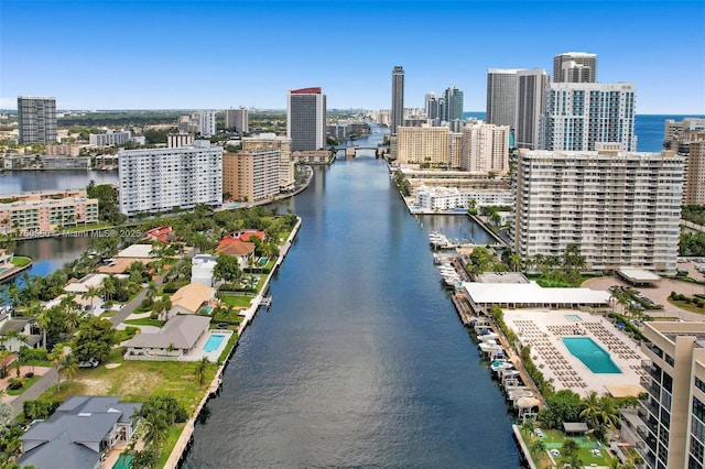 birds eye view of property with a city view and a water view