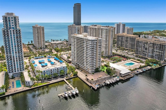 drone / aerial view with a view of city and a water view