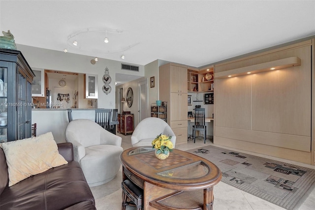 living room with visible vents and light tile patterned flooring