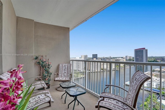 balcony with a city view and a water view