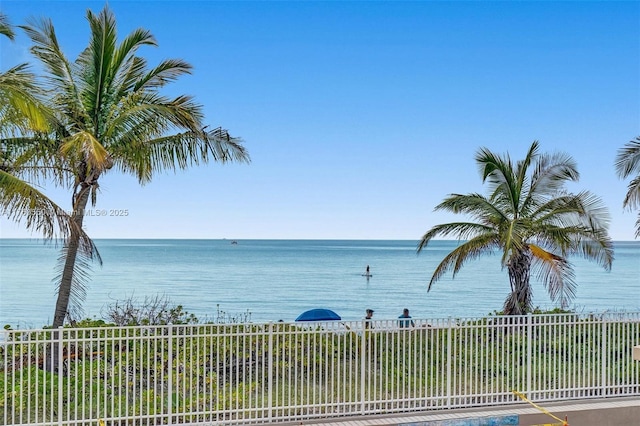 view of water feature with fence