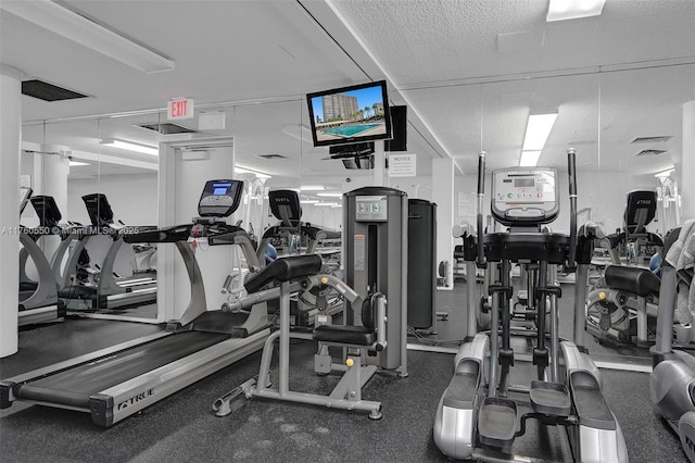 workout area with a textured ceiling