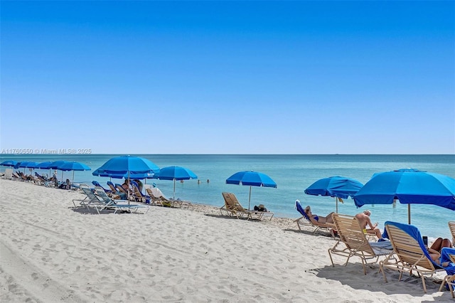 property view of water featuring a beach view