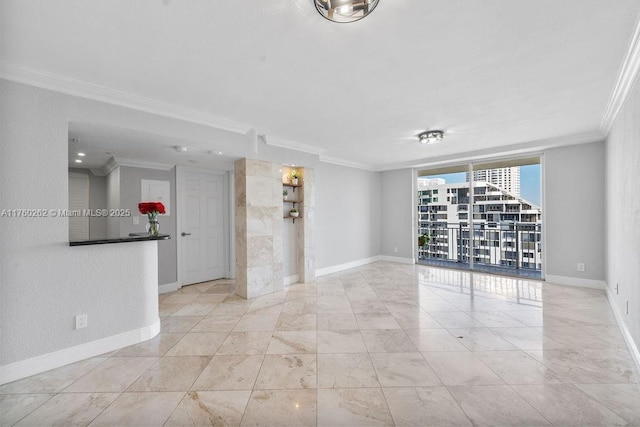 spare room with baseboards, ornamental molding, and floor to ceiling windows