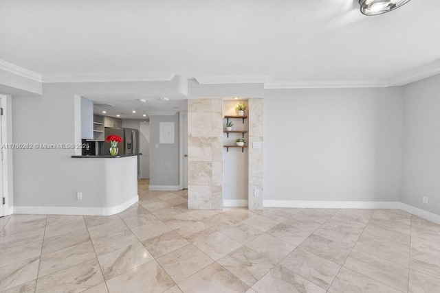 unfurnished room with baseboards and ornamental molding