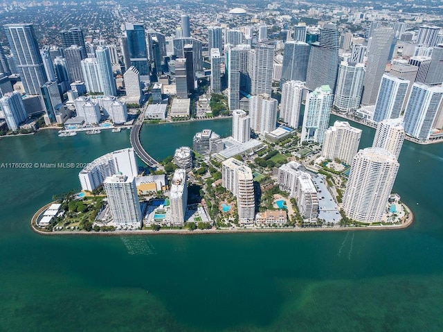 birds eye view of property featuring a water view and a city view