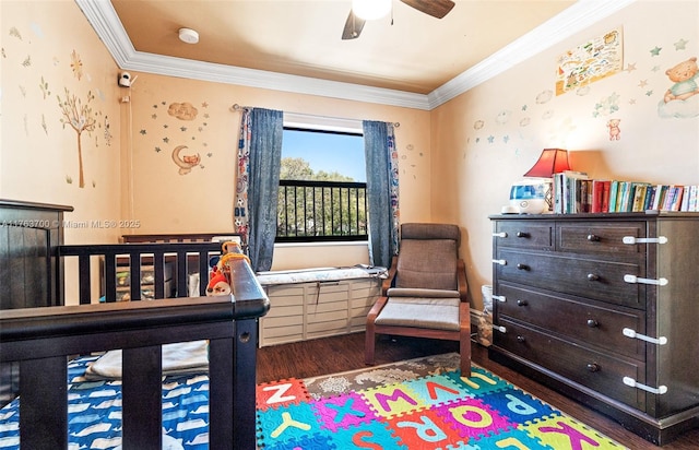 bedroom with wood finished floors, a ceiling fan, and ornamental molding