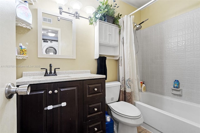 bathroom featuring visible vents, shower / bathtub combination with curtain, toilet, washer / dryer, and vanity