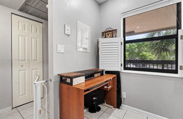 3059 Carambola Cir S Unit 2033, Coconut Creek, FL 33066 - tiled office space featuring a textured wall, baseboards, and electric panel