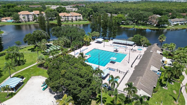 birds eye view of property with a water view