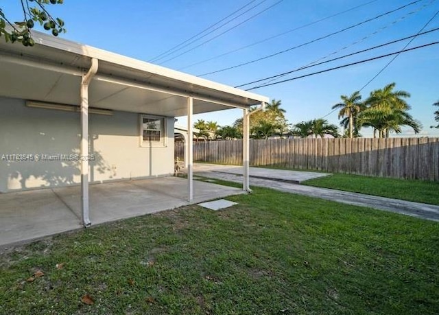 view of yard featuring a patio and fence