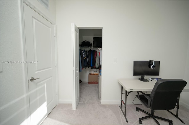 home office with light carpet and baseboards