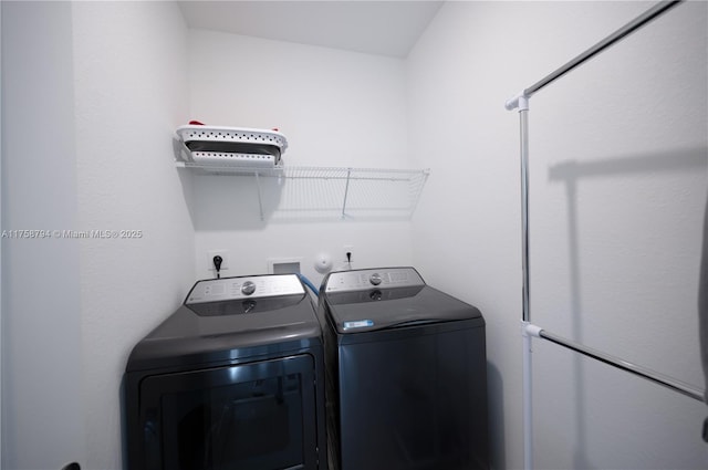 laundry area with laundry area and washing machine and clothes dryer