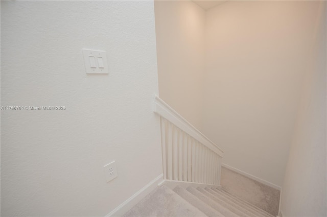 staircase with carpet and baseboards