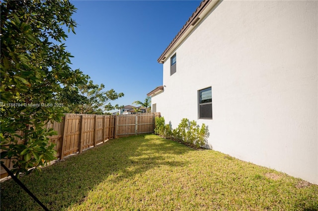 view of yard with a fenced backyard