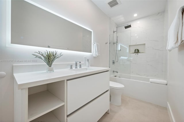 full bathroom featuring visible vents, toilet, vanity, tile patterned flooring, and shower / bathtub combination