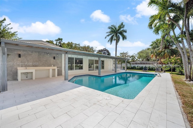 view of pool with a patio area and a fenced in pool