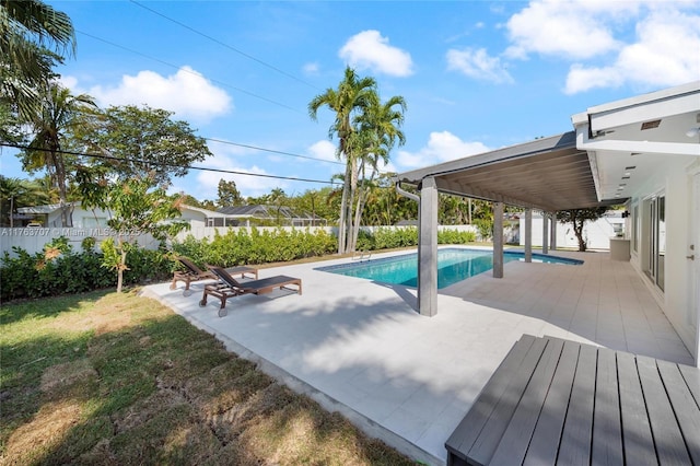 view of swimming pool featuring a patio area, a fenced backyard, a fenced in pool, and a lawn