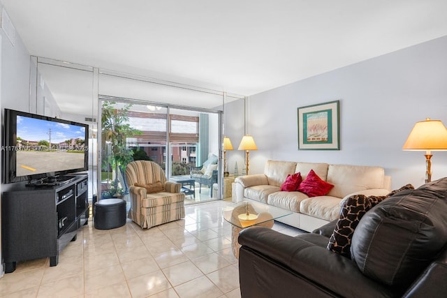 living area featuring light tile patterned floors and expansive windows