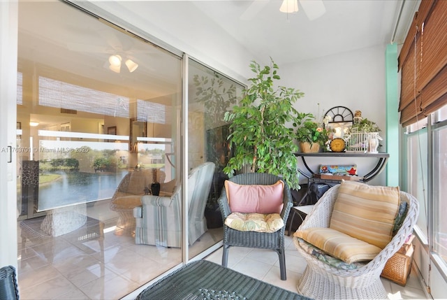 sunroom with ceiling fan