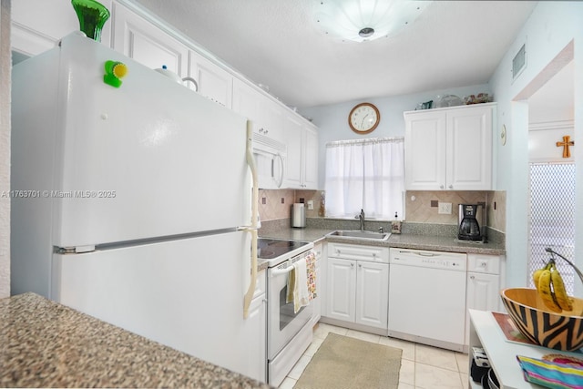 kitchen featuring a sink, white appliances, tasteful backsplash, and white cabinets