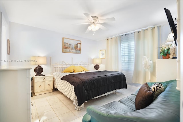 bedroom featuring light tile patterned floors and a ceiling fan