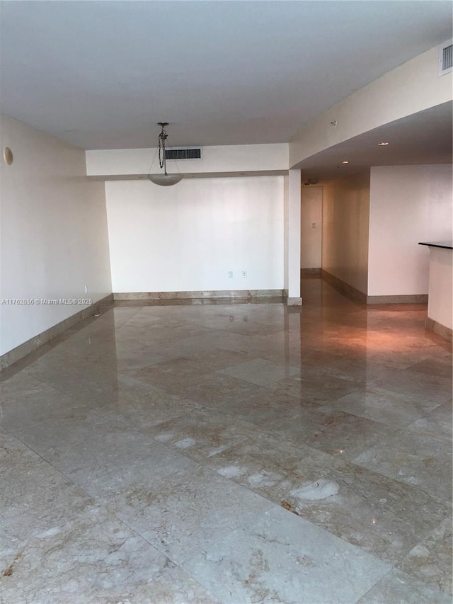 garage featuring visible vents and baseboards