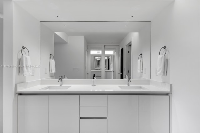 bathroom with double vanity and a sink