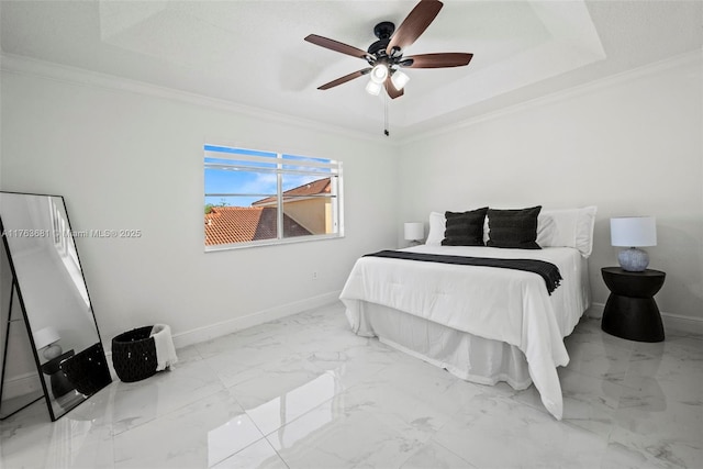 bedroom with marble finish floor, a raised ceiling, baseboards, and ornamental molding