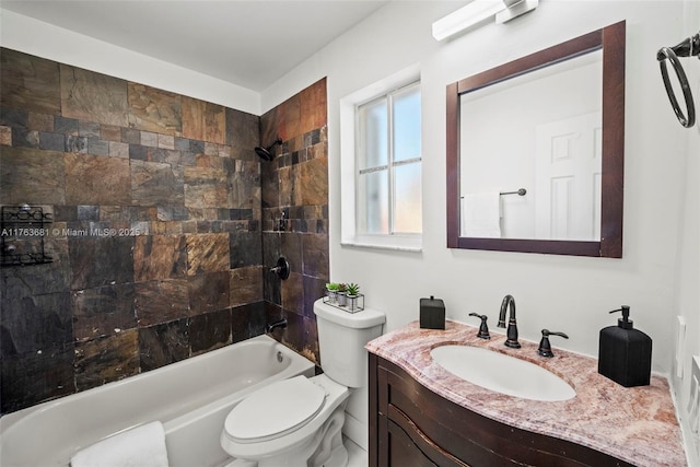 full bath featuring toilet, vanity, and shower / bathing tub combination