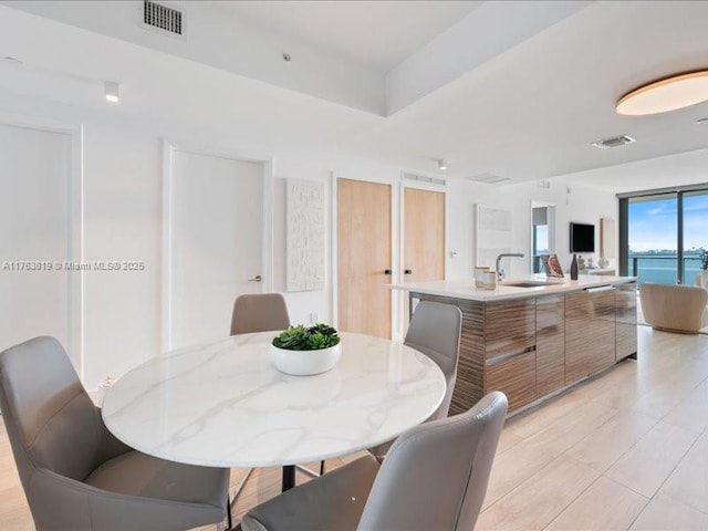 dining space featuring visible vents