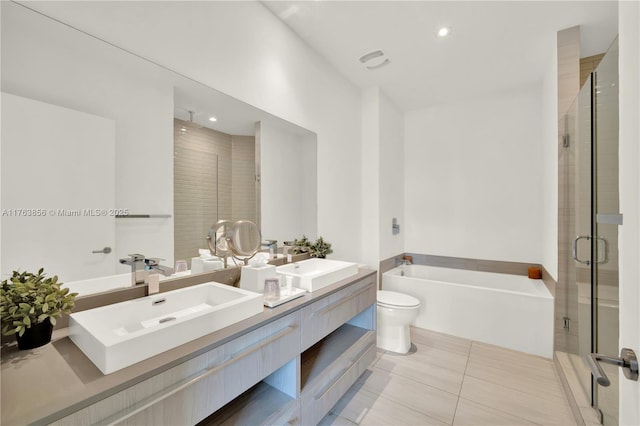 bathroom with a bath, tile patterned flooring, a shower stall, and a sink