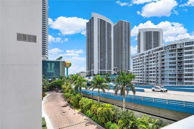 view of pool with a view of city