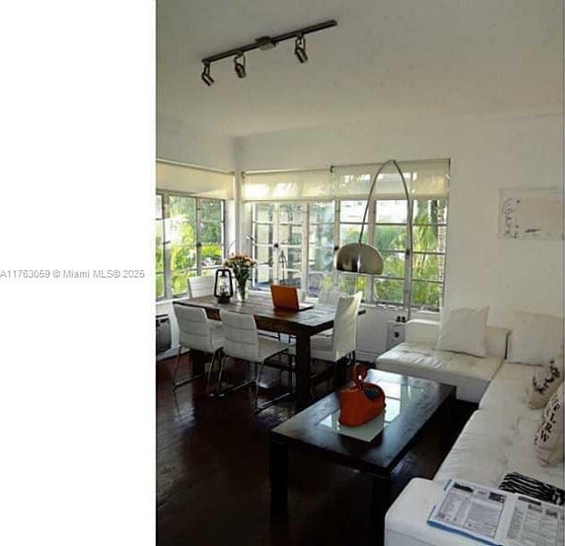 living room featuring plenty of natural light and wood finished floors