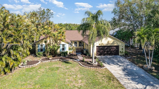 view of front facade featuring concrete driveway, an attached garage, a front yard, and stucco siding