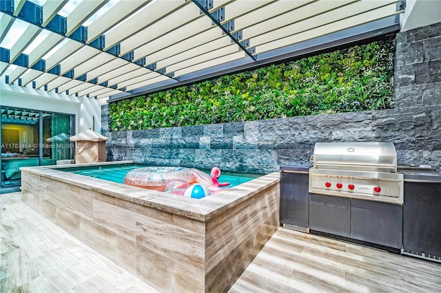 exterior space featuring grilling area, a hot tub, and a pergola