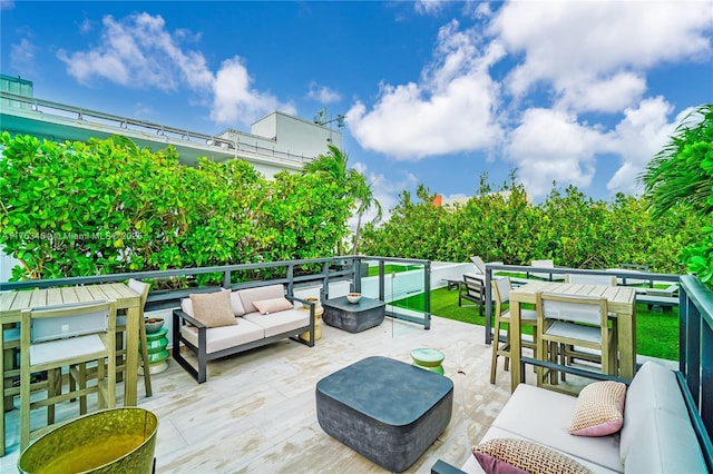 deck featuring outdoor lounge area and a patio