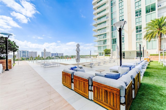 view of home's community featuring a city view and outdoor lounge area