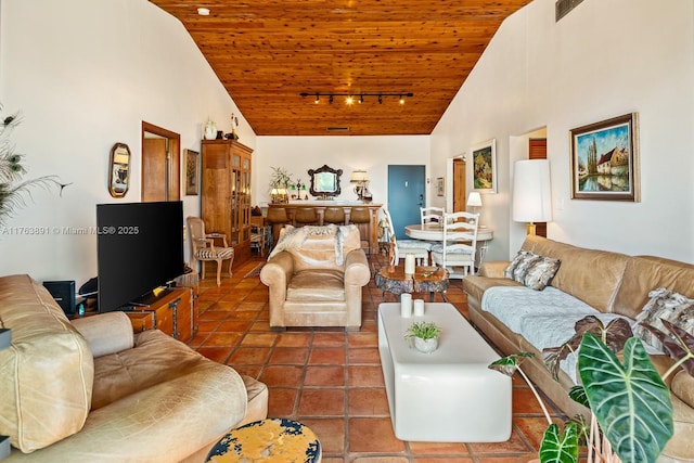 living area with high vaulted ceiling, wooden ceiling, track lighting, and tile patterned flooring