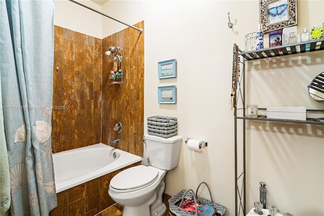 full bathroom featuring toilet and shower / bath combo with shower curtain