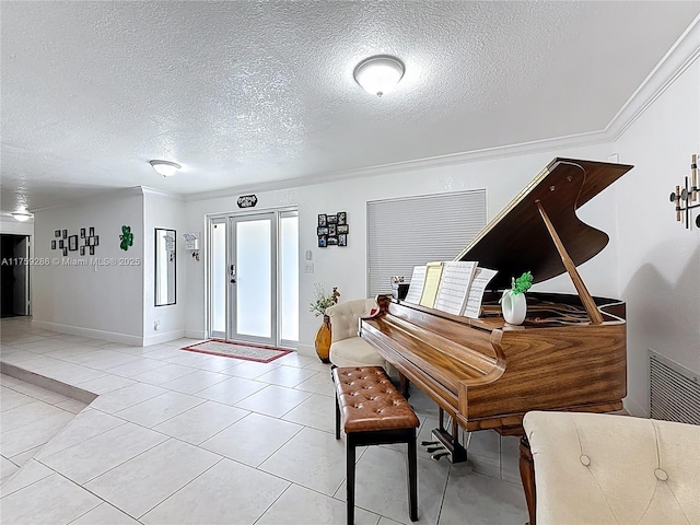 entrance foyer featuring light tile patterned floors, baseboards, a textured ceiling, and crown molding