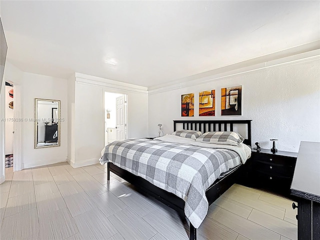 bedroom featuring baseboards