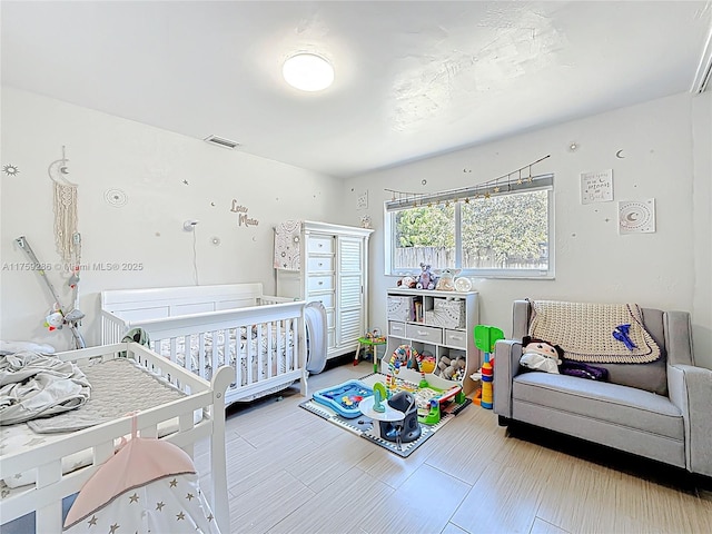 bedroom featuring visible vents