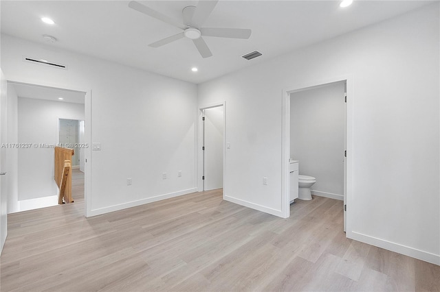 unfurnished bedroom featuring visible vents, light wood-style flooring, recessed lighting, connected bathroom, and baseboards