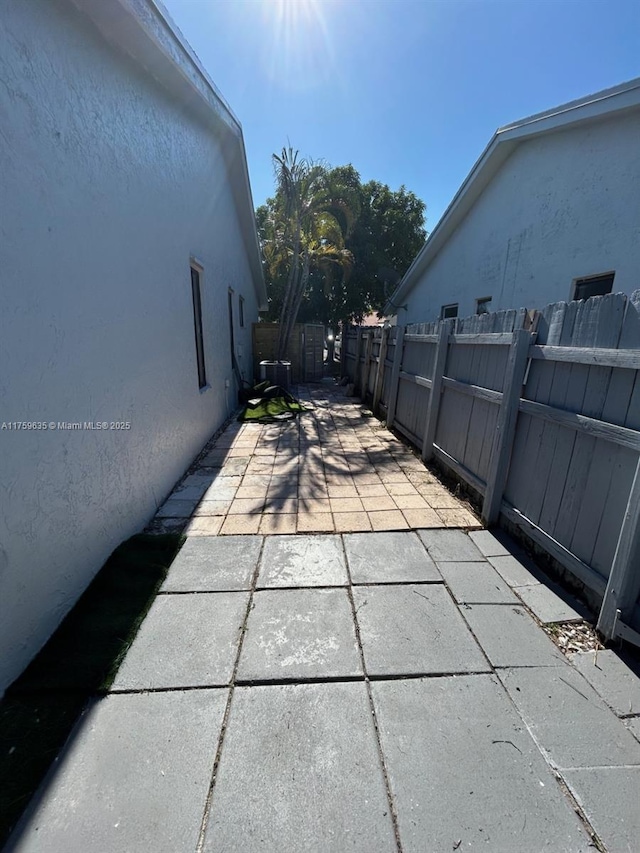 view of patio featuring fence