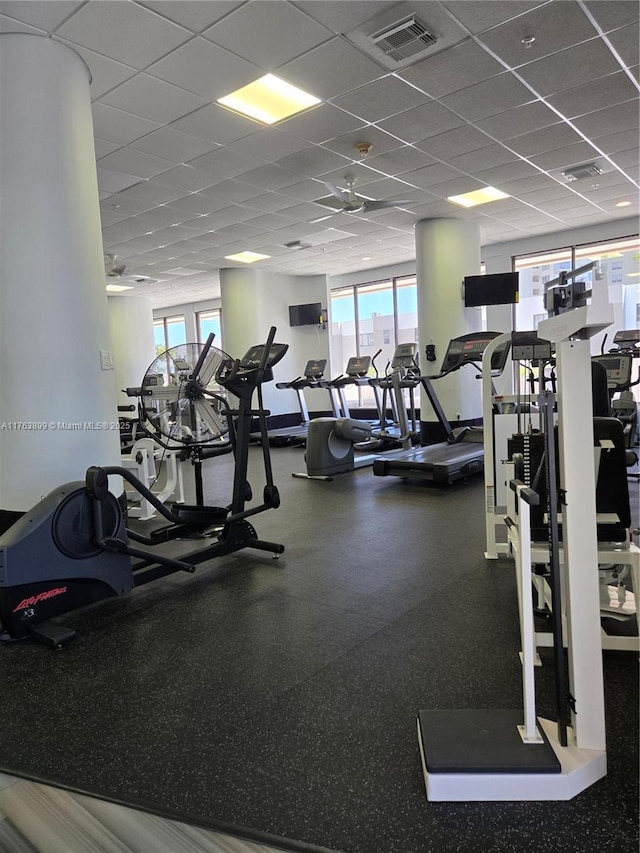 gym featuring a drop ceiling and visible vents