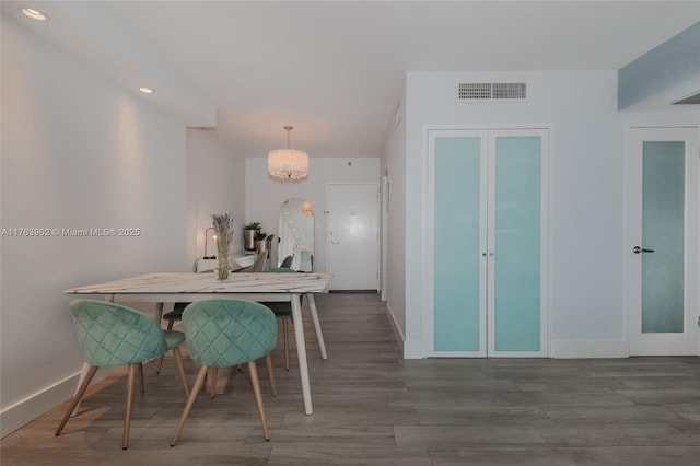 dining area with recessed lighting, a notable chandelier, baseboards, and visible vents