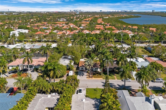 bird's eye view featuring a residential view and a water view