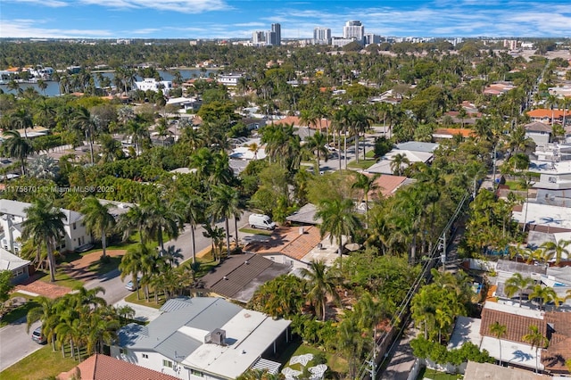 birds eye view of property with a view of city and a water view